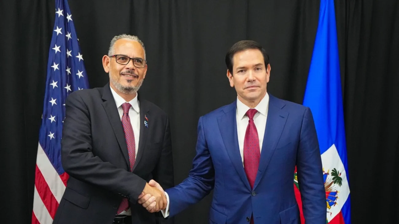 Alix Didier Fils-Aimé y Marco Rubio.